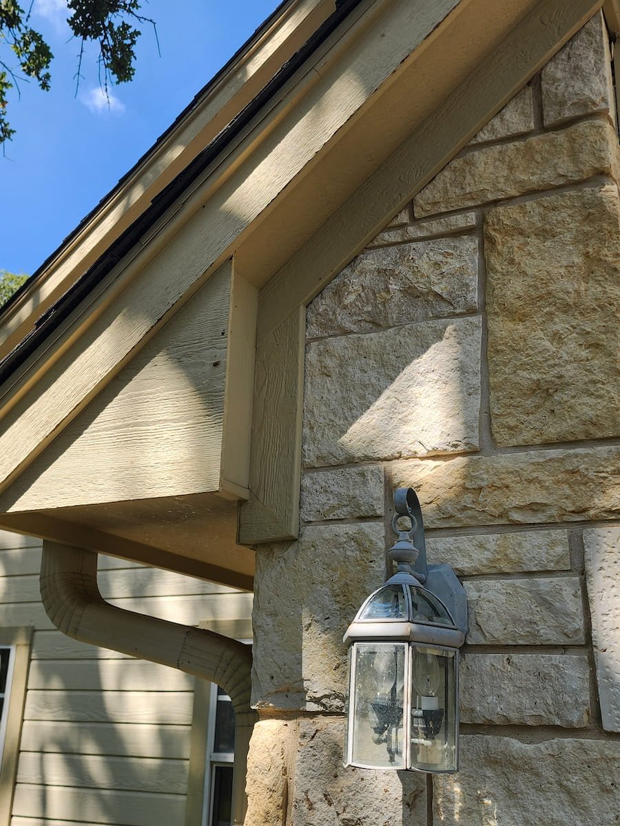 House washing after cleaning in Streetman, TX showing clean soffit and roof eaves