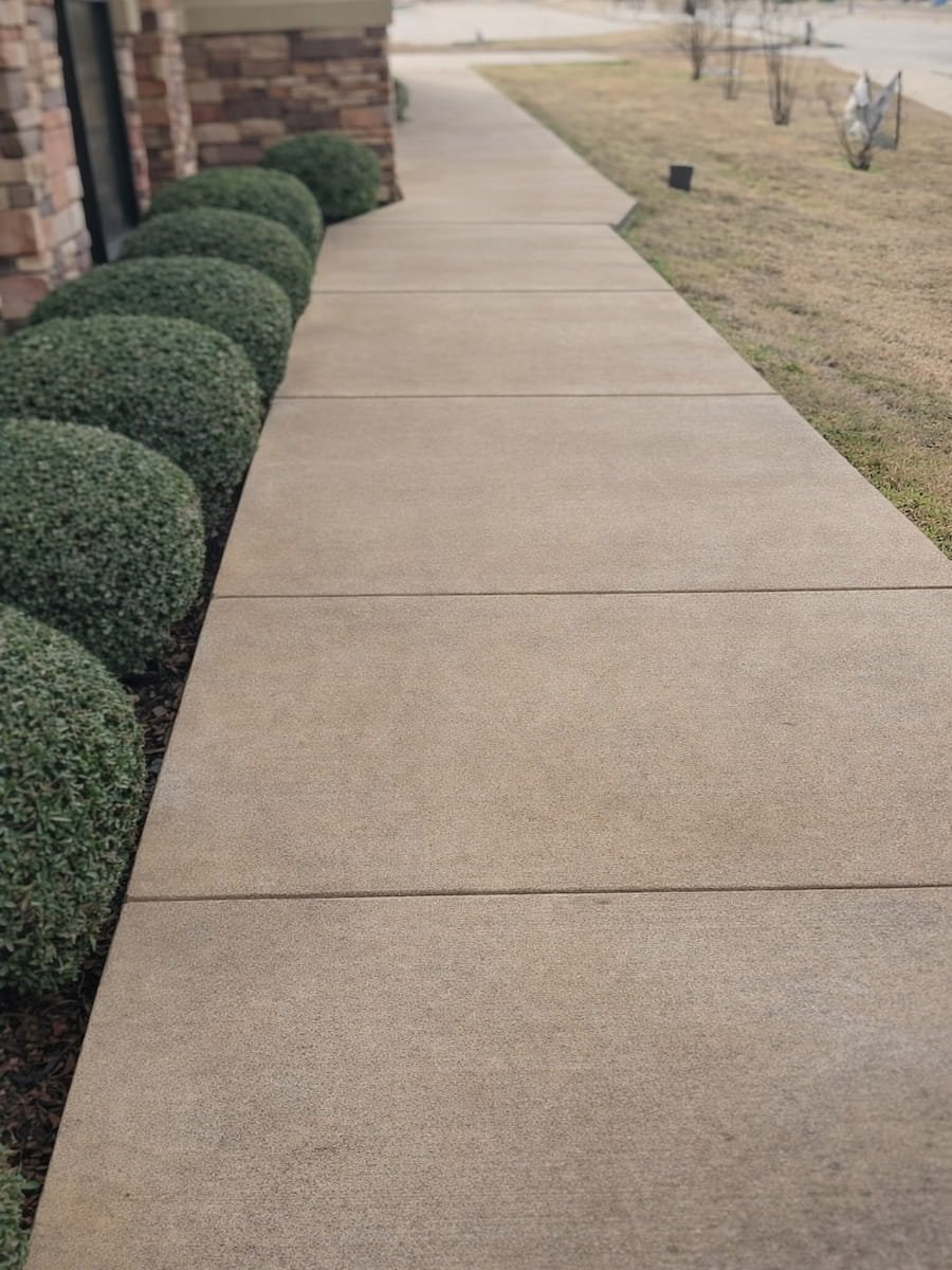 Concrete driveway after pressure washing in Corsicana TX showing clean concrete surface