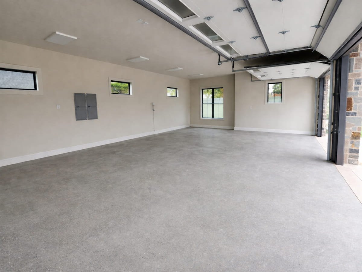 Clean garage concrete floor after pressure washing construction cleanup near Richland Chambers Lake Texas