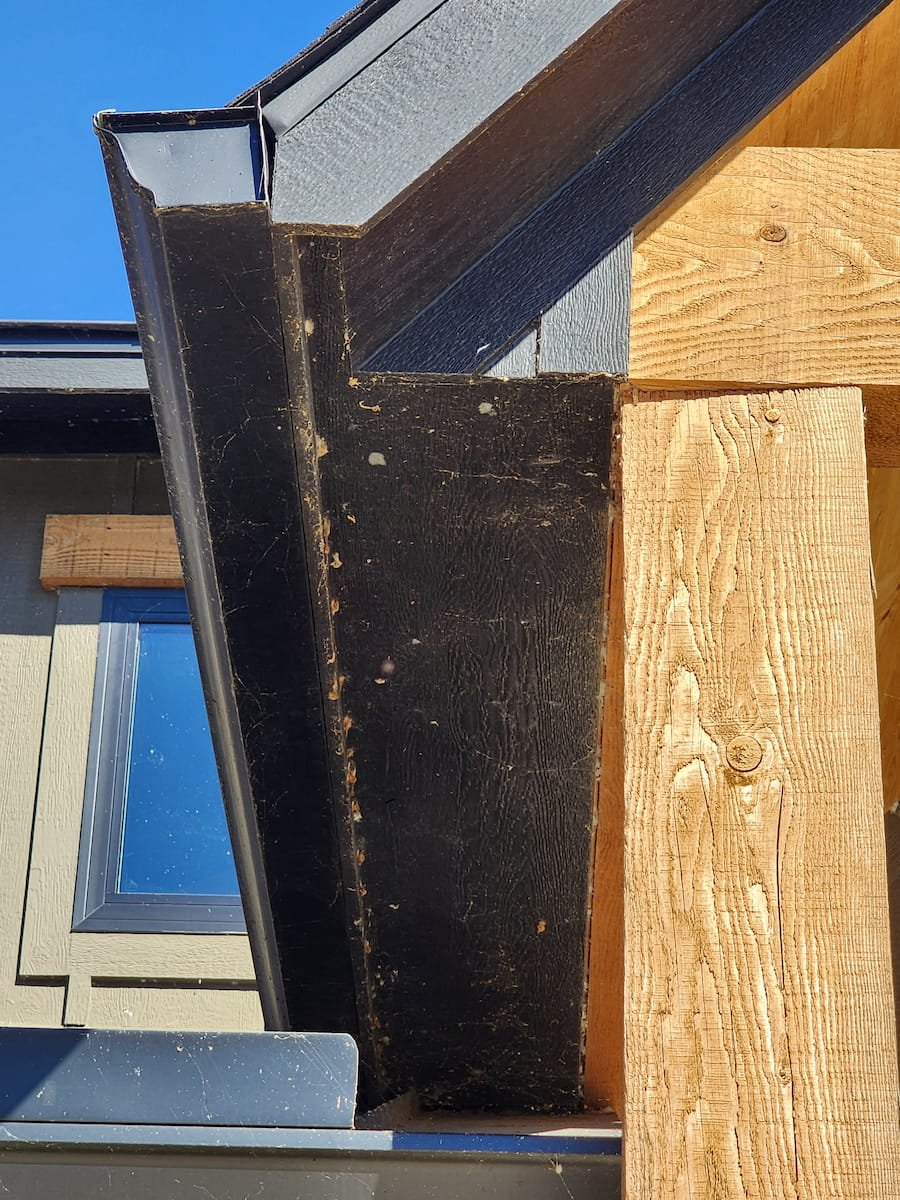 Dirty fascia and gutter trim with spider webs and buildup before house washing near Richland Chambers Lake Texas