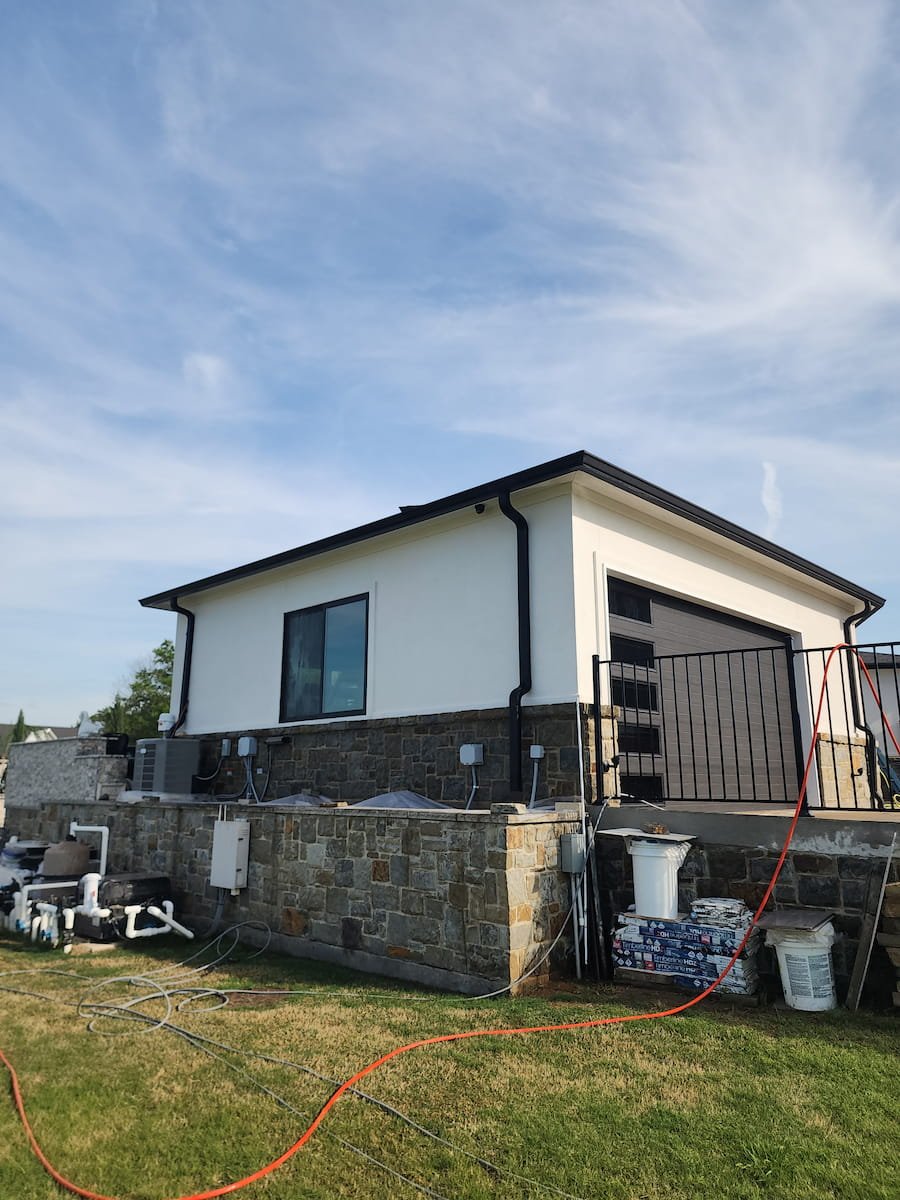 House washing on Richland Chambers Lake in Corsicana TX cleaning stucco exterior and stone base