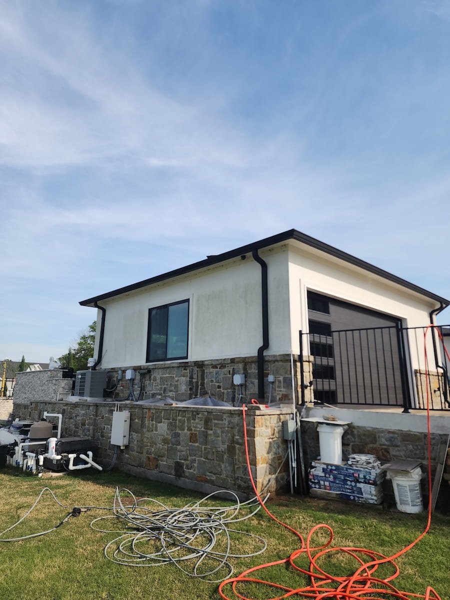 House washing on Richland Chambers Lake in Corsicana TX cleaning stucco exterior and stone base