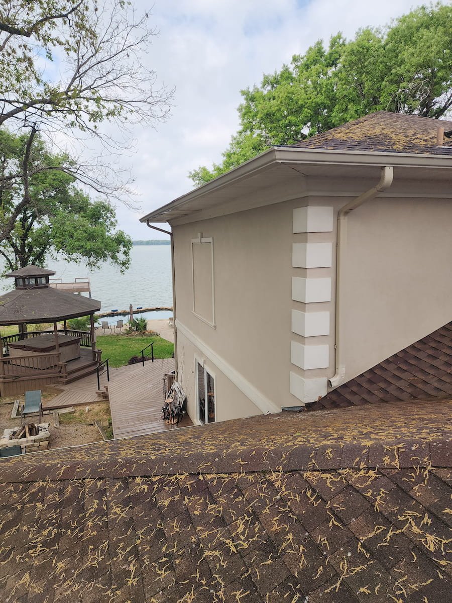 House washing on Richland Chambers Lake in Kerens TX cleaning stucco exterior, gutter, and soffits