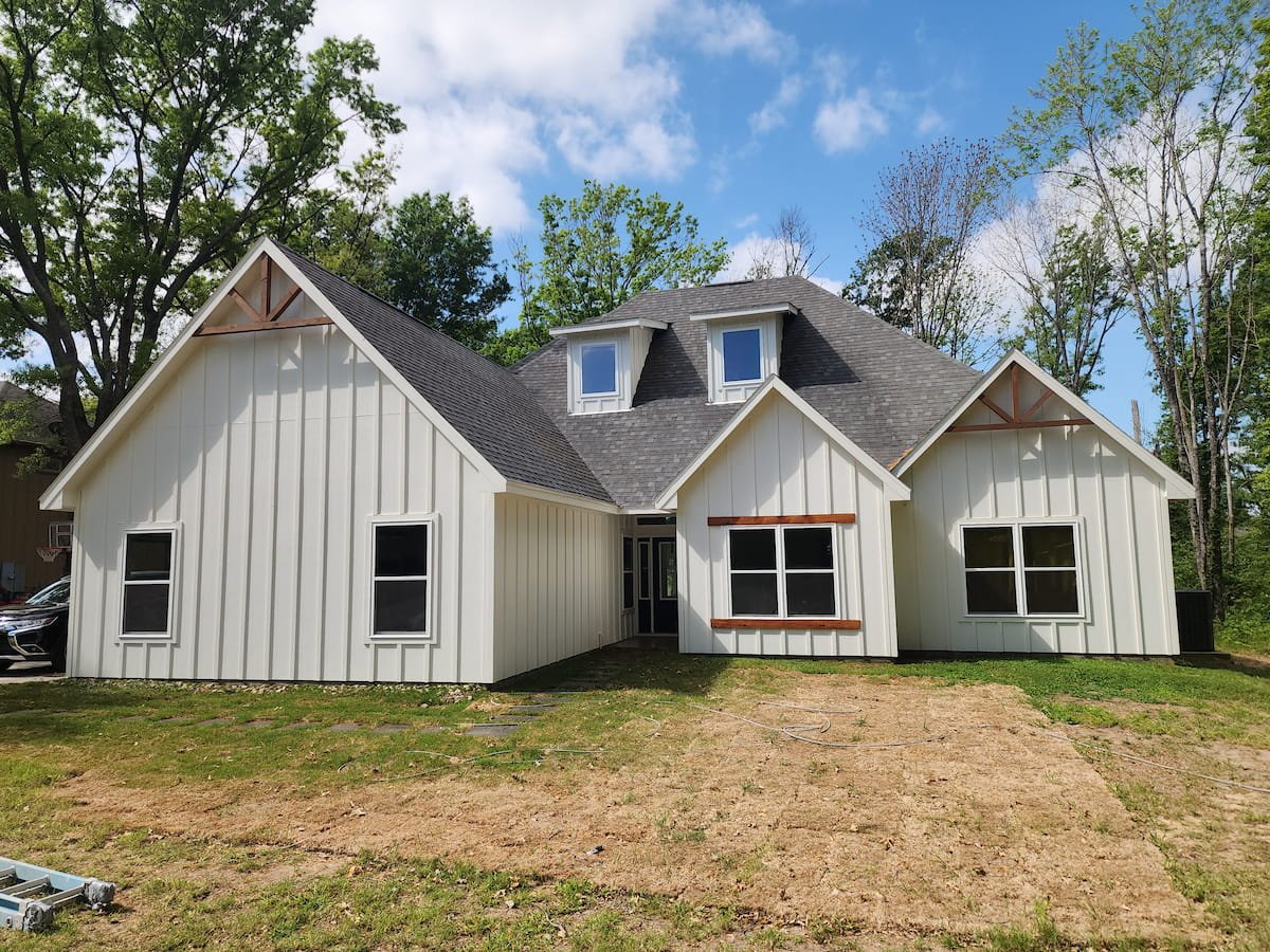 House washing in Corsicana TX restoring siding, trim, and soffits on painted Hardie board exterior