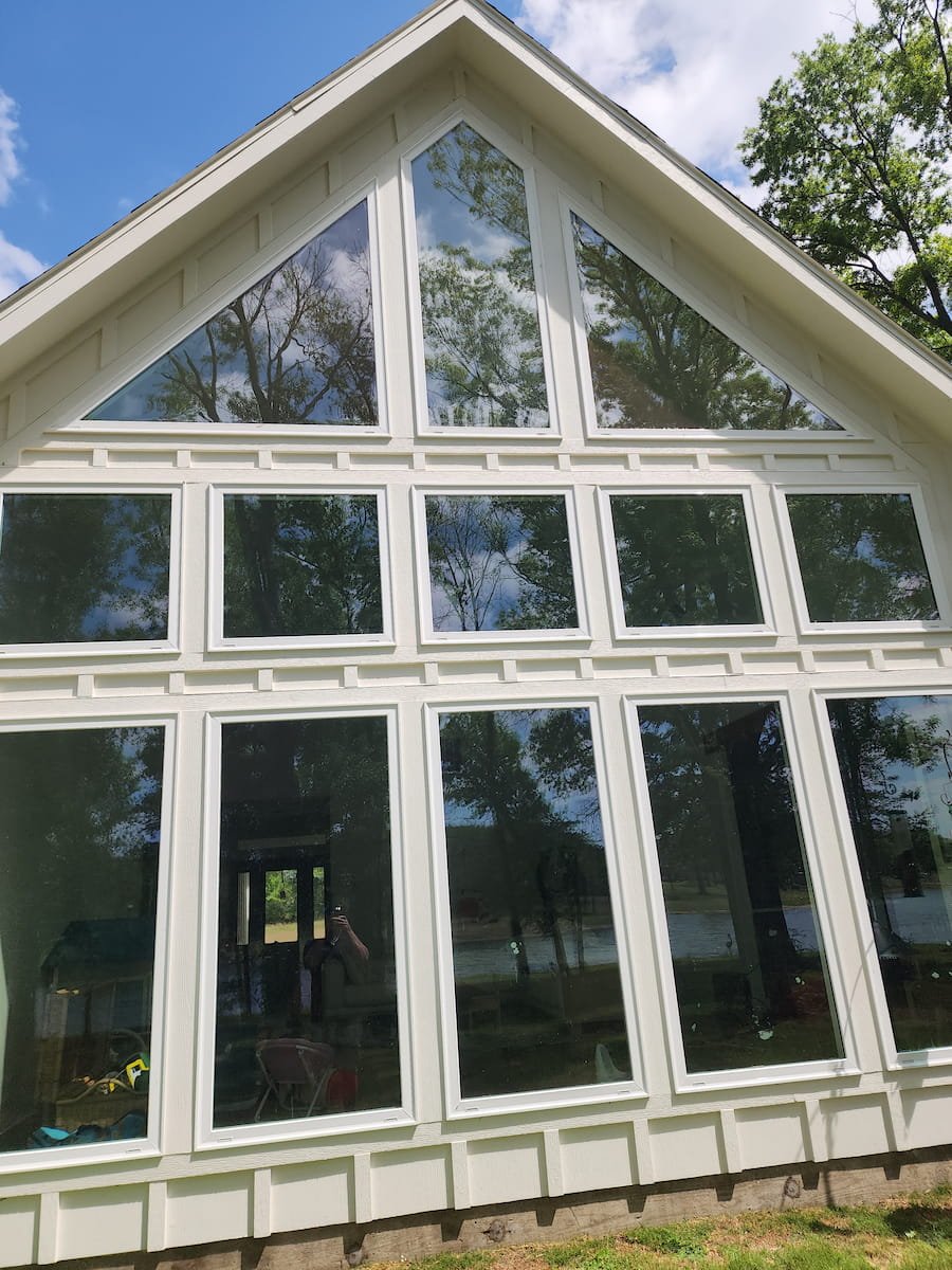 House washing in Corsicana TX restoring siding, trim, and soffits on painted Hardie board exterior