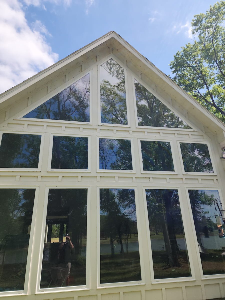 House washing in Corsicana TX restoring siding, trim, and soffits on painted Hardie board exterior