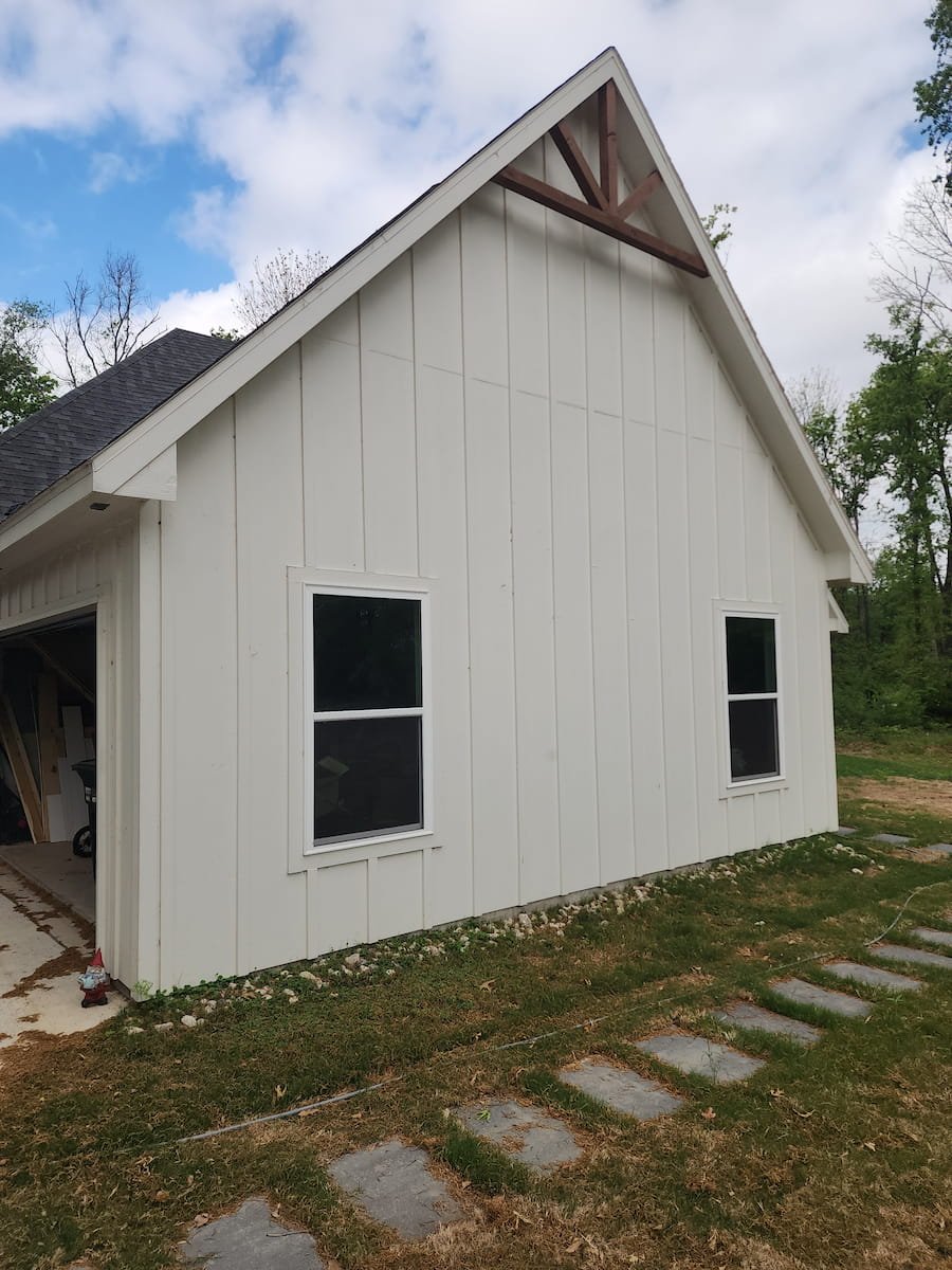 House washing in Corsicana TX restoring siding, trim, and soffits on painted Hardie board exterior
