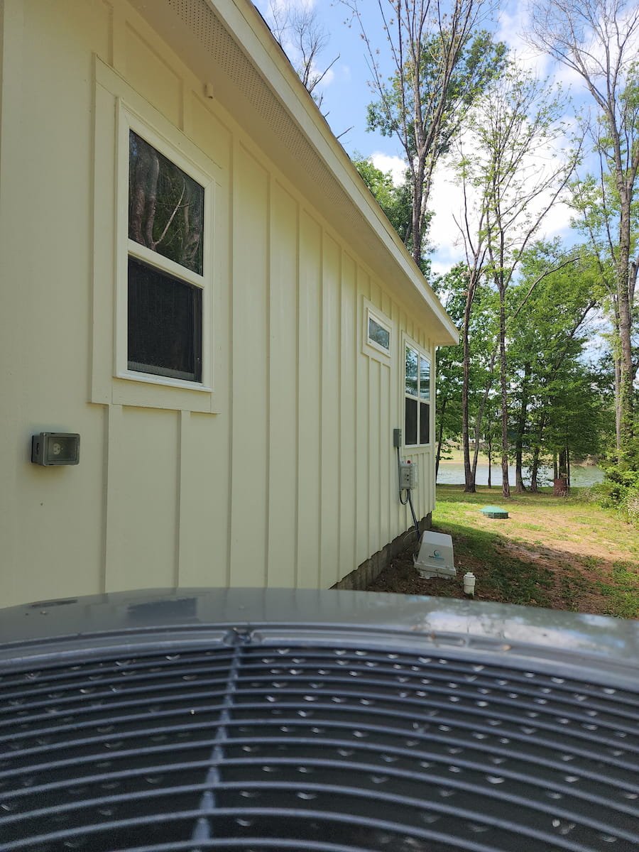 House washing in Corsicana TX restoring siding, trim, and soffits on painted Hardie board exterior