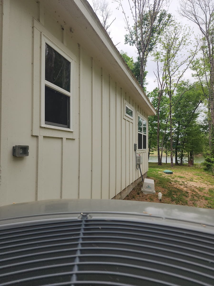 House washing in Corsicana TX restoring siding, trim, and soffits on painted Hardie board exterior