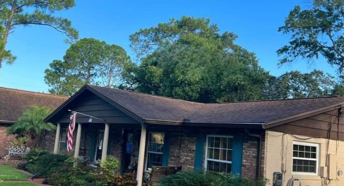 Asphalt shingle roof with heavy black algae streaks before roof cleaning in Corsicana Texas