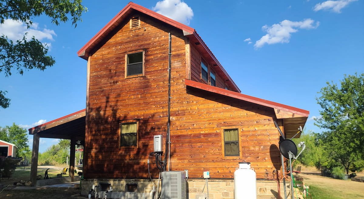 Restored wood siding after professional wood restoration cleaning in Kerens Texas